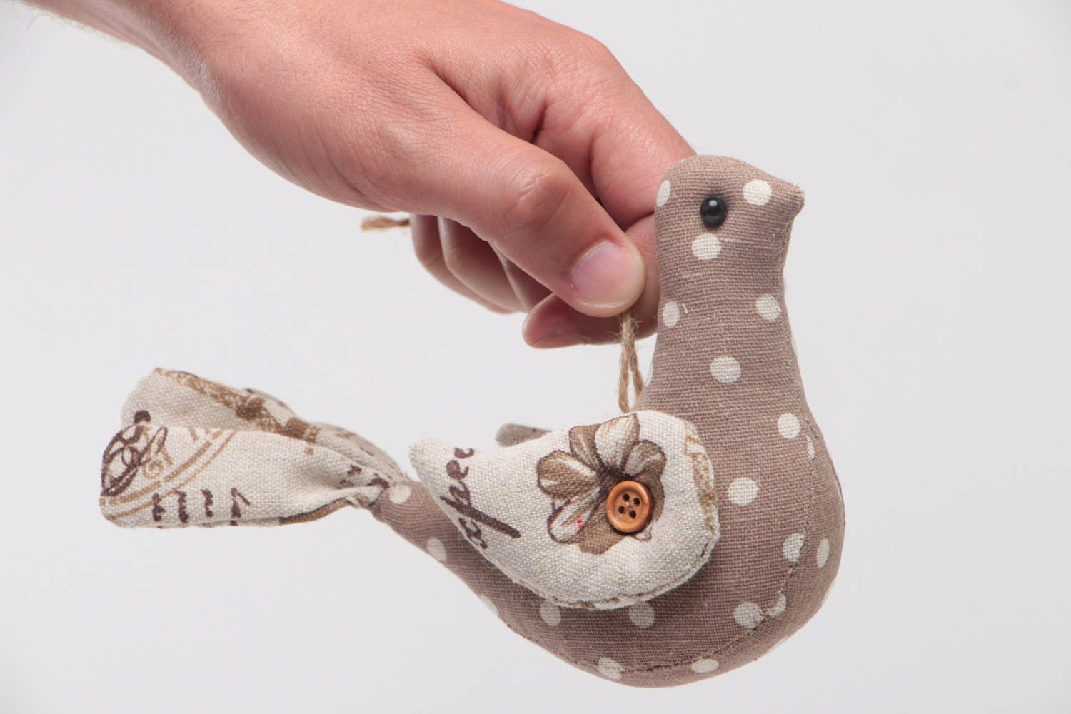 Small handmade decorative wall hanging soft toy bird sewn of beige fabric  photo 5