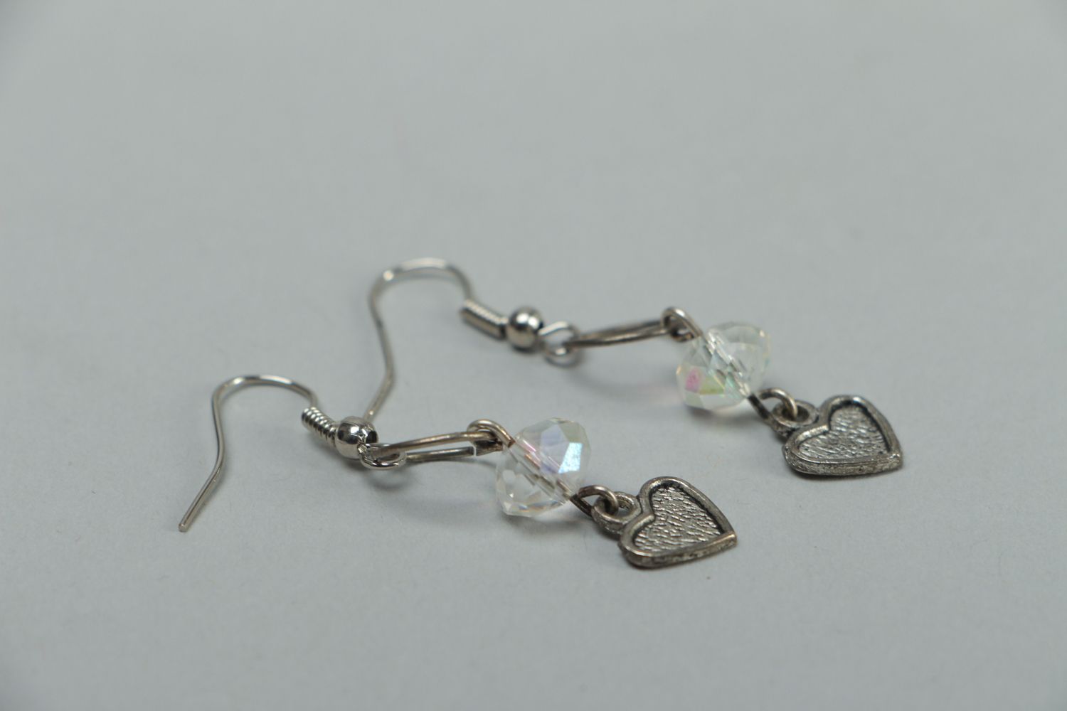 Metal earrings with heart beads photo 2