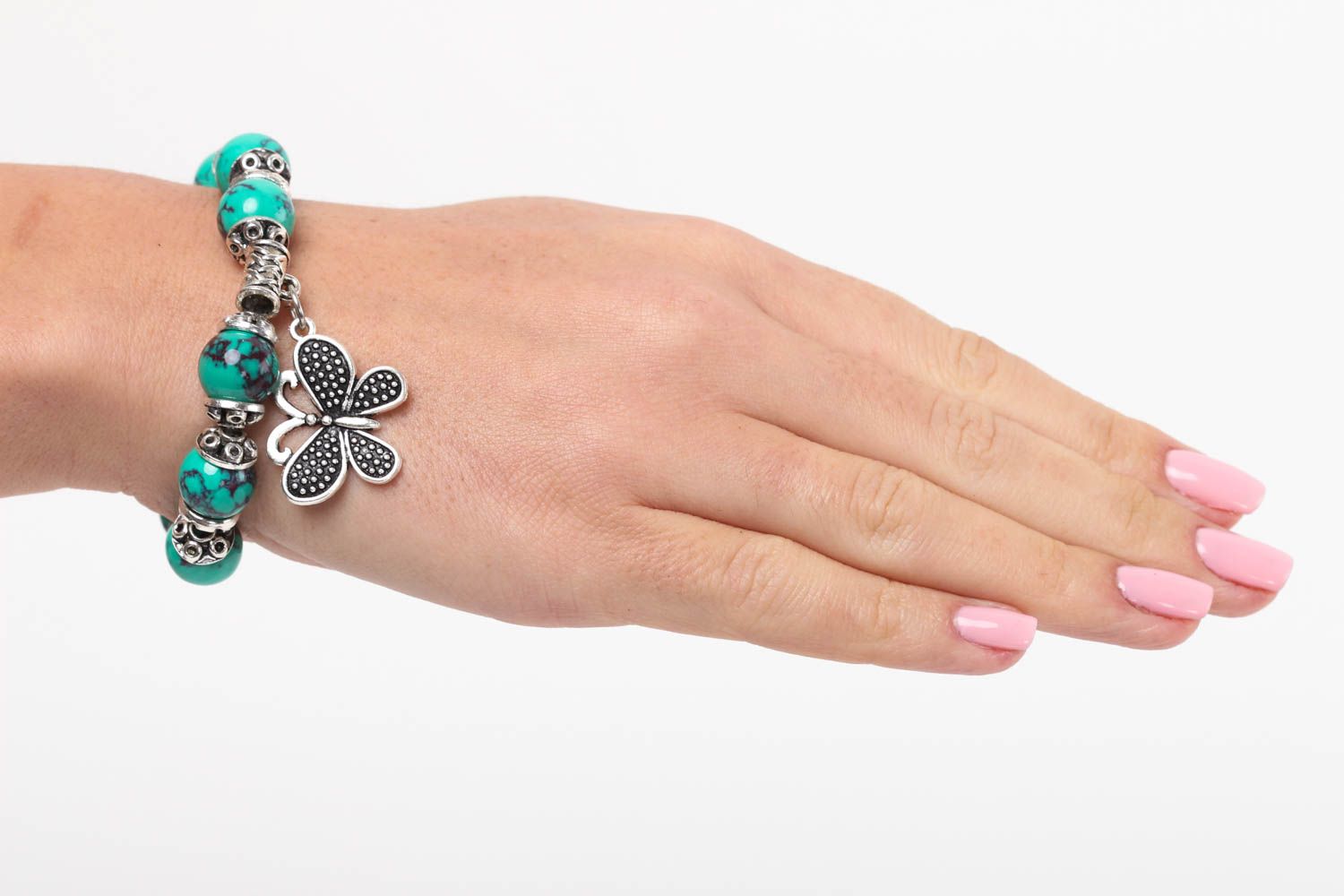 Natural turquoise stone beaded wrist bracelet with metal charms and central butterfly charm photo 5