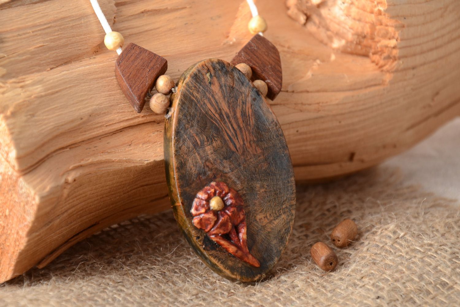 Handmade dark tinted wooden neck pendant of oval shape with flower for women photo 1
