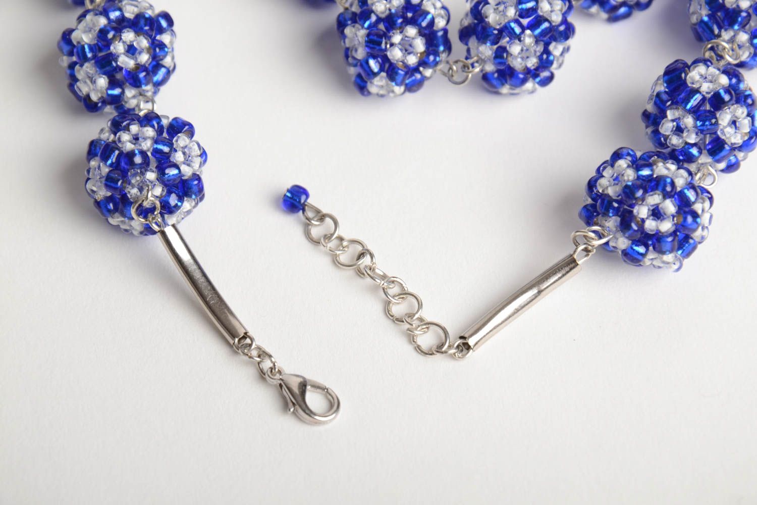 Handmade designer women's necklace with balls crocheted of blue and white beads photo 4