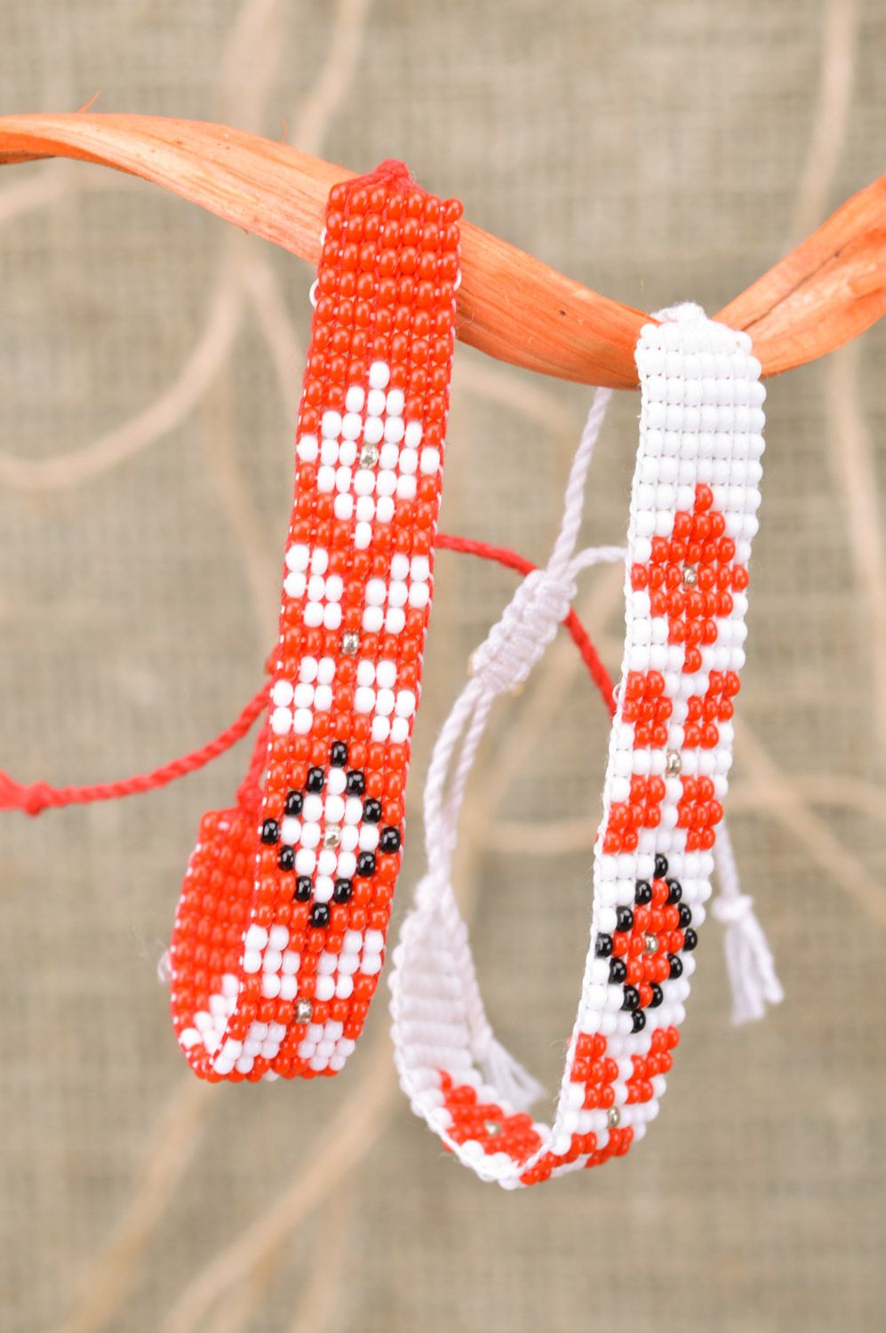 Set of 2 handmade white and red beaded ornamented bracelets with ties for women photo 1