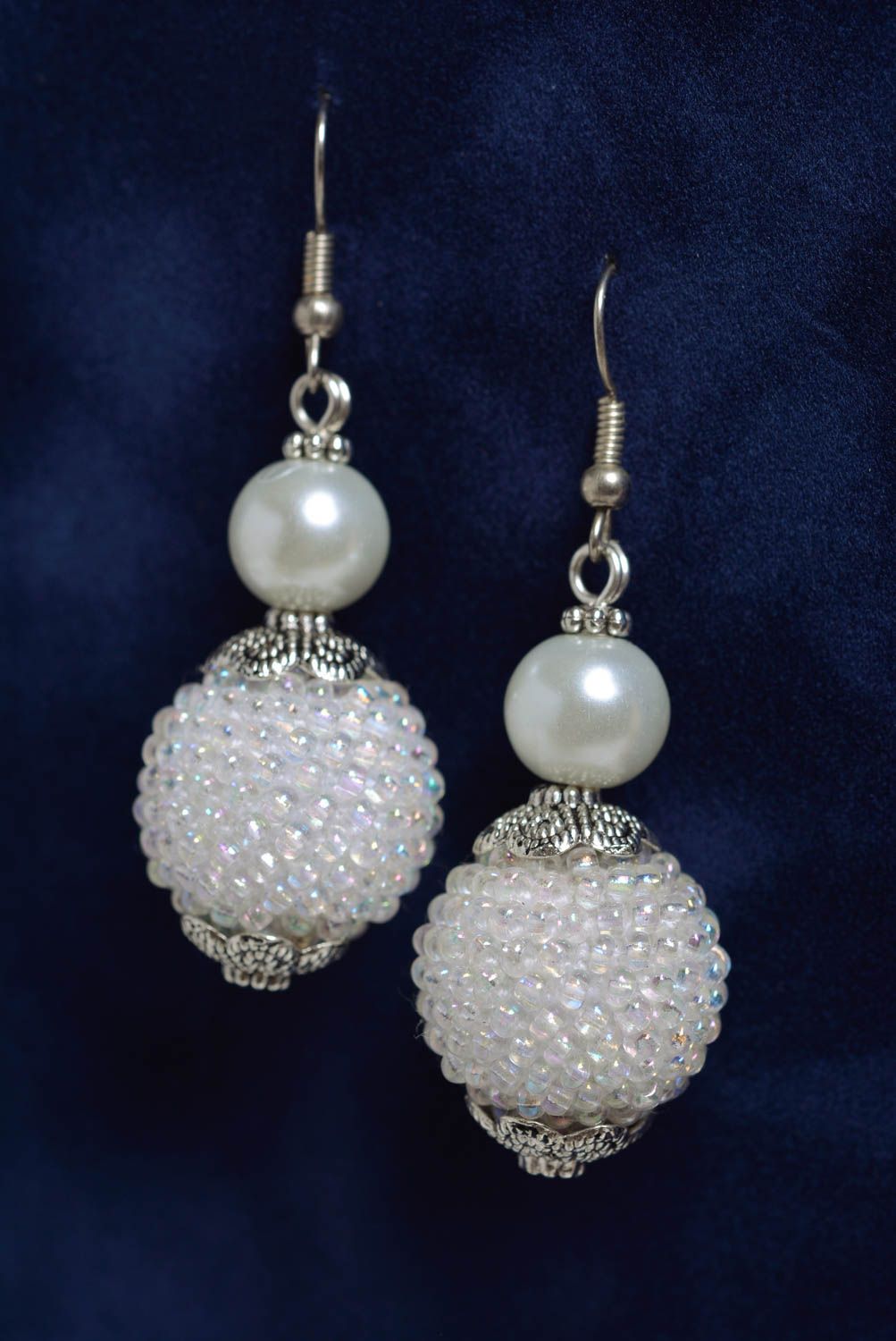 Handmade long dangling earrings with bead woven balls of snow white color photo 1