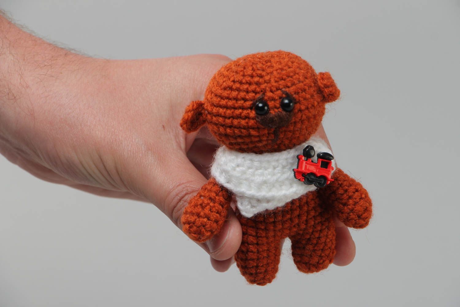 Soft handmade crocheted toy bear in brown with a small collar present for baby photo 5