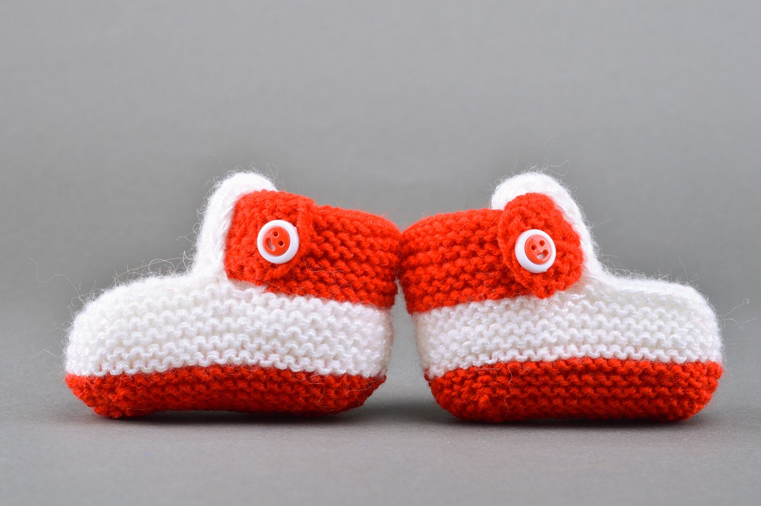 Red and white handmade knitted half-woolen baby booties with buttons photo 2