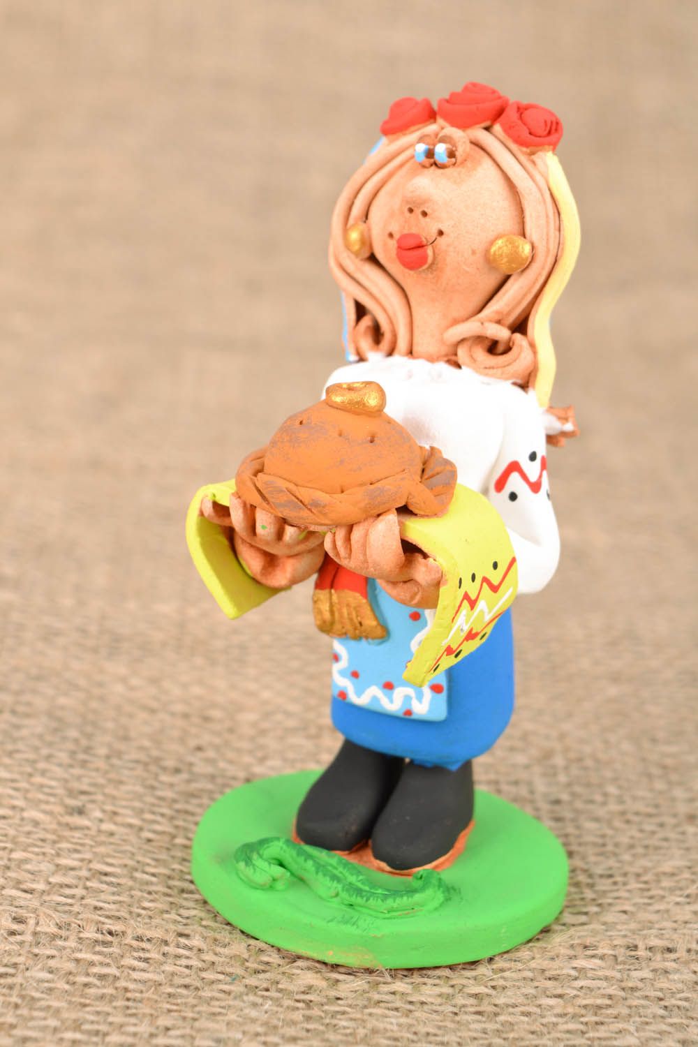 Funny clay figurine Cossack Woman with Ethnic Round Loaf photo 1