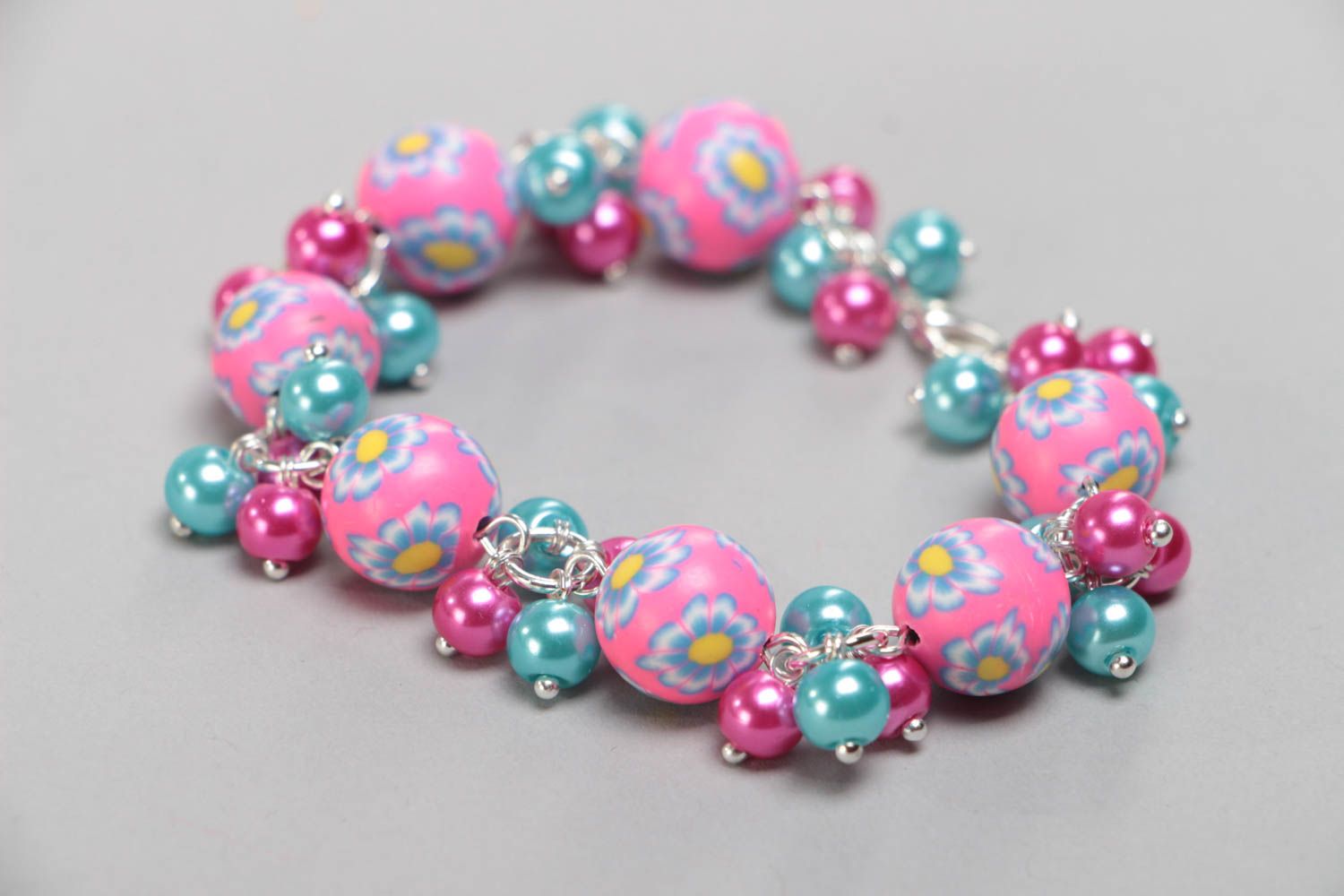 Beautiful bright handmade children's bracelet with plastic and ceramic beads photo 2