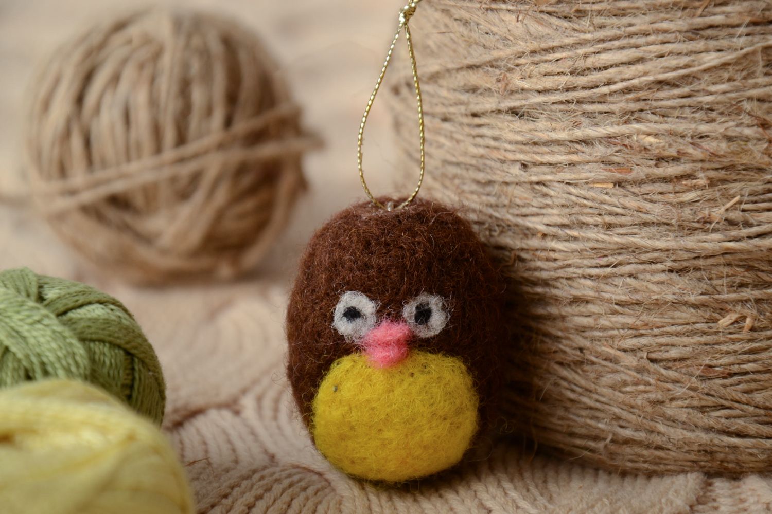 Small felted toy with eyelet photo 1
