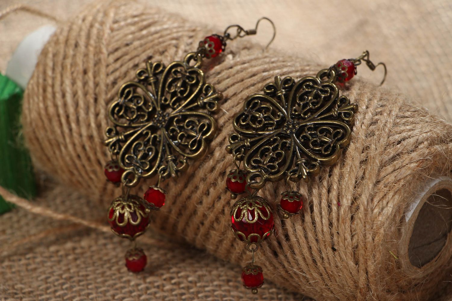Metal earrings with glass beads of red color photo 5