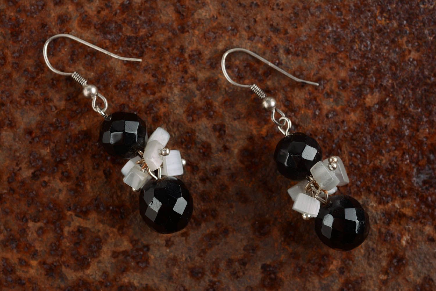 Metal earrings with black crystal photo 1