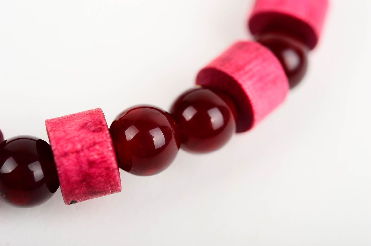 The wide wooden handmade beaded bracelet with dark red and light red beads on elastic cord photo 4