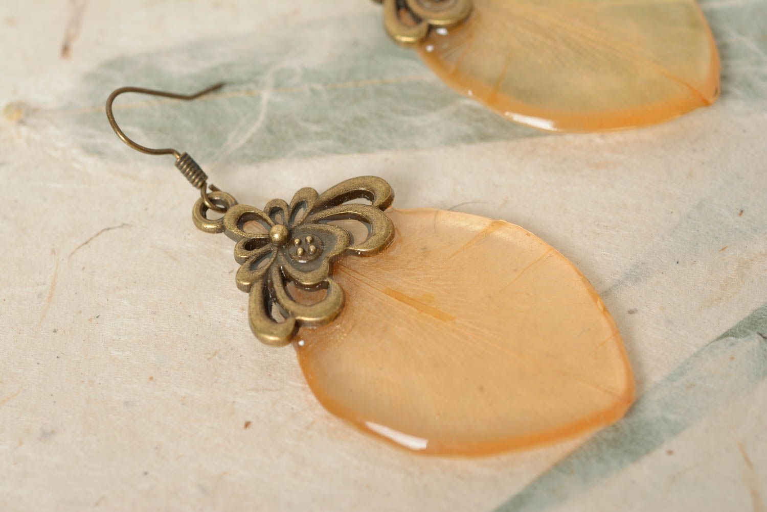 Handmade designer dangle earrings with transparent flower petal in epoxy resin photo 3