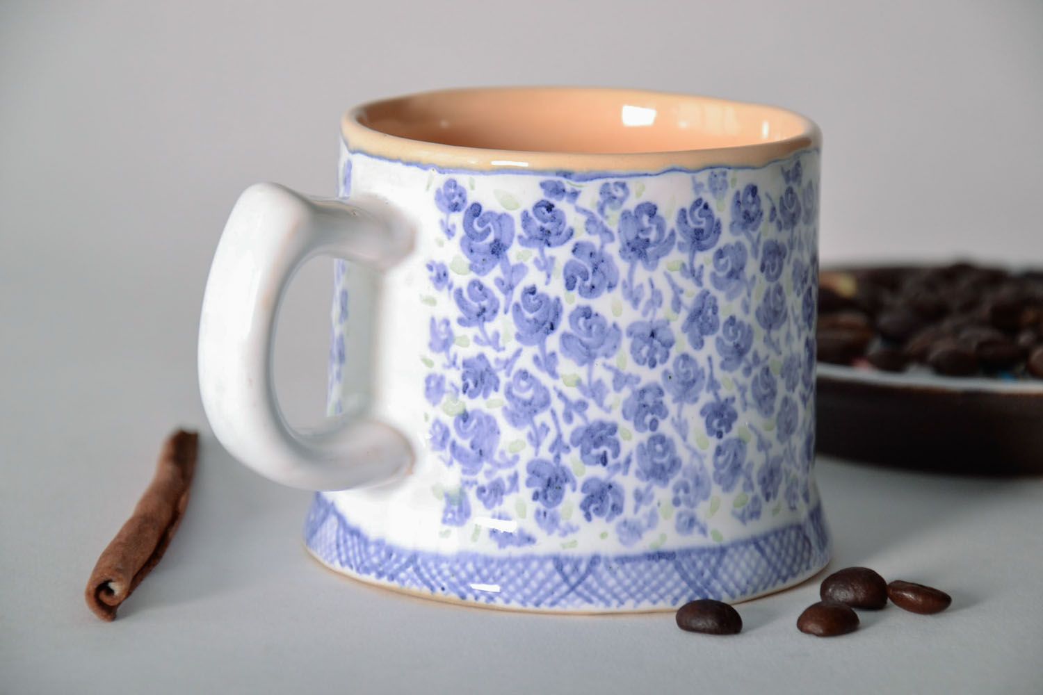 Handmade porcelain clay cup in white and violet color with handle and violets' pattern photo 1