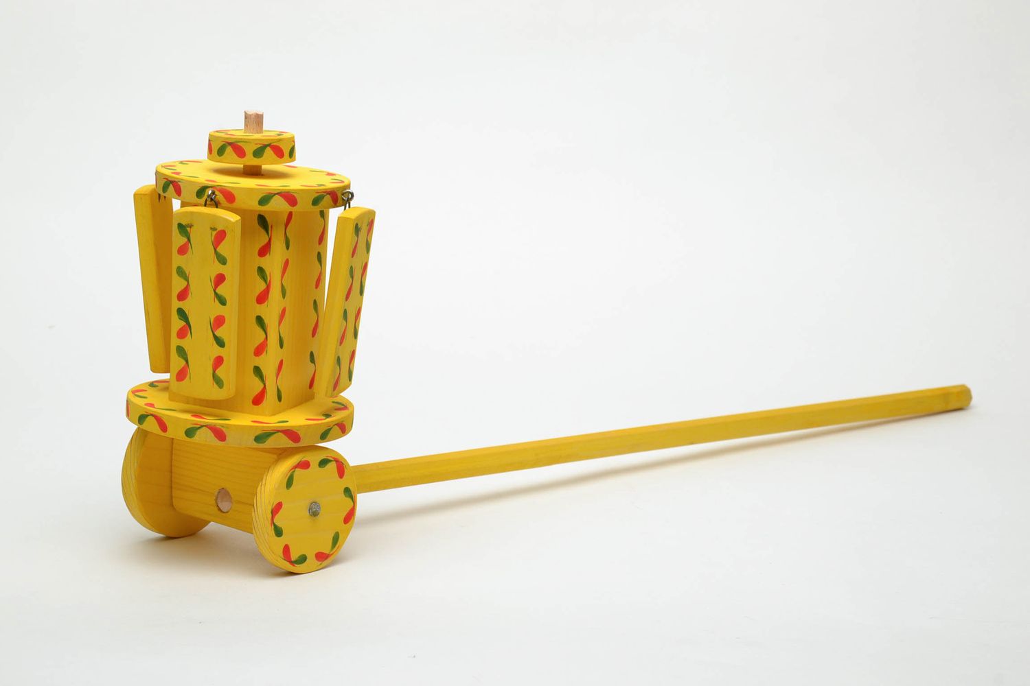 Painted wooden toy with wheels  photo 2