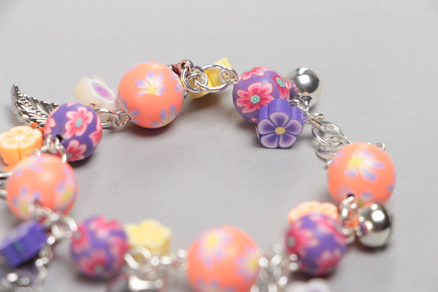 Unusual colorful handmade children's plastic wrist bracelet with charms photo 4