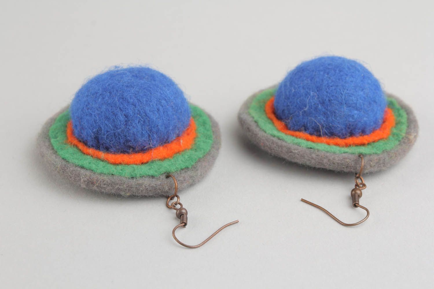 Round earrings made of wool and felt using felting technique photo 3