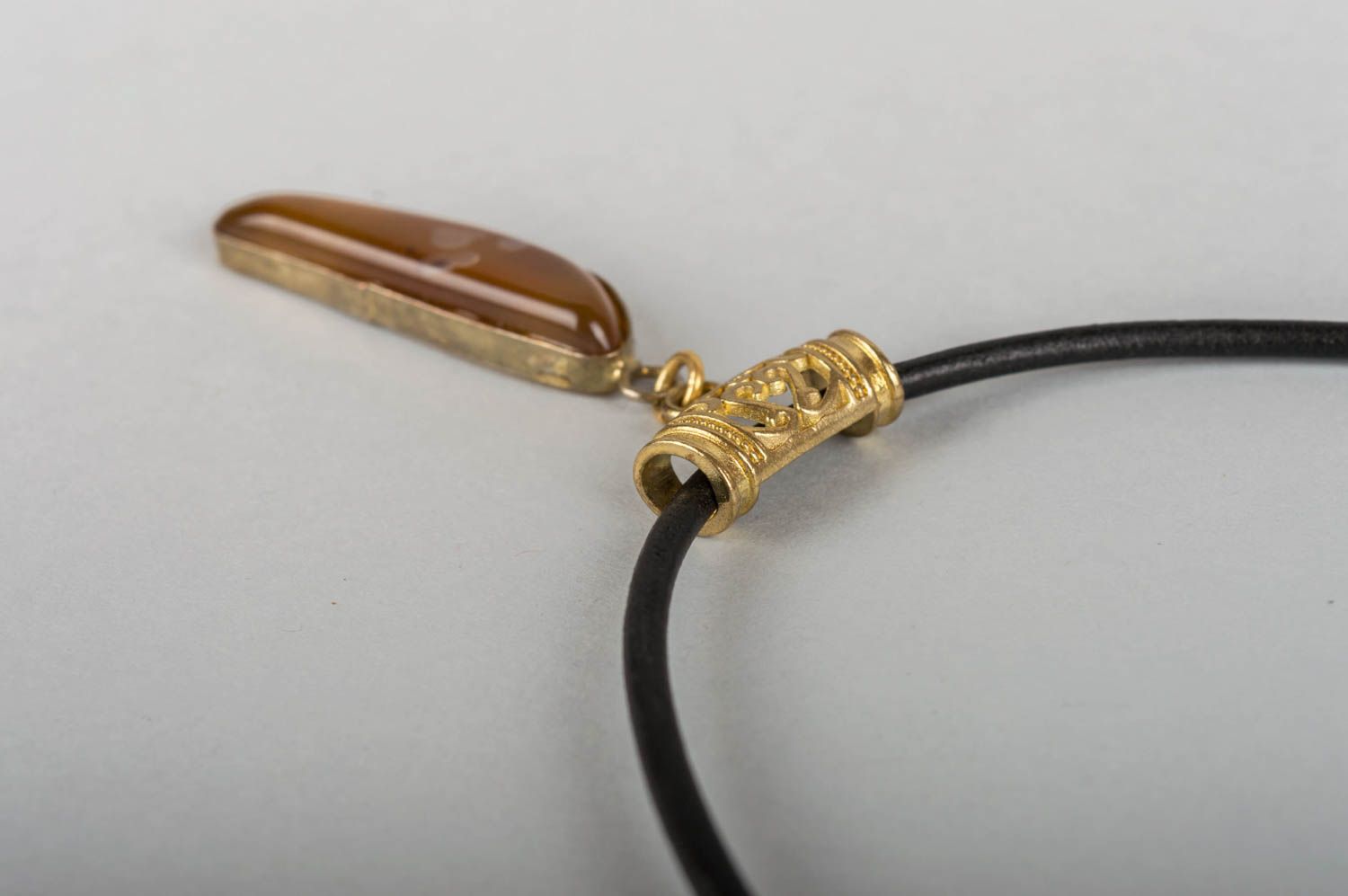 Beautiful stylish handmade neck pendant with natural stone on leather cord photo 4