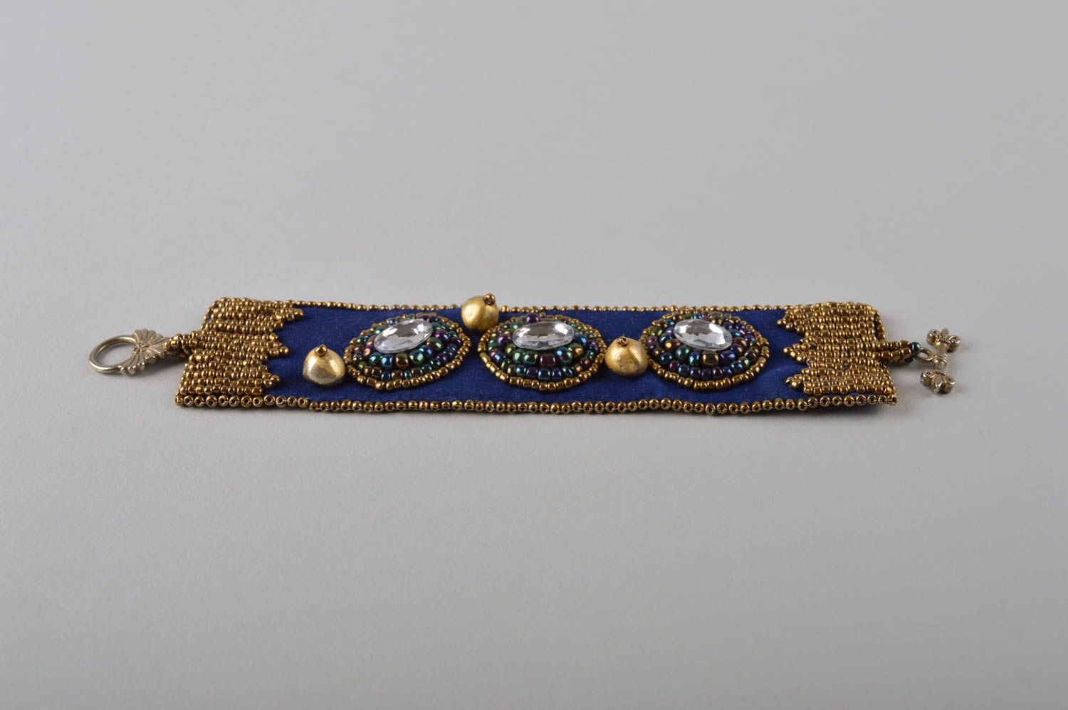 Handmade beaded dark blue bracelet with crystal charms and gold beads photo 5