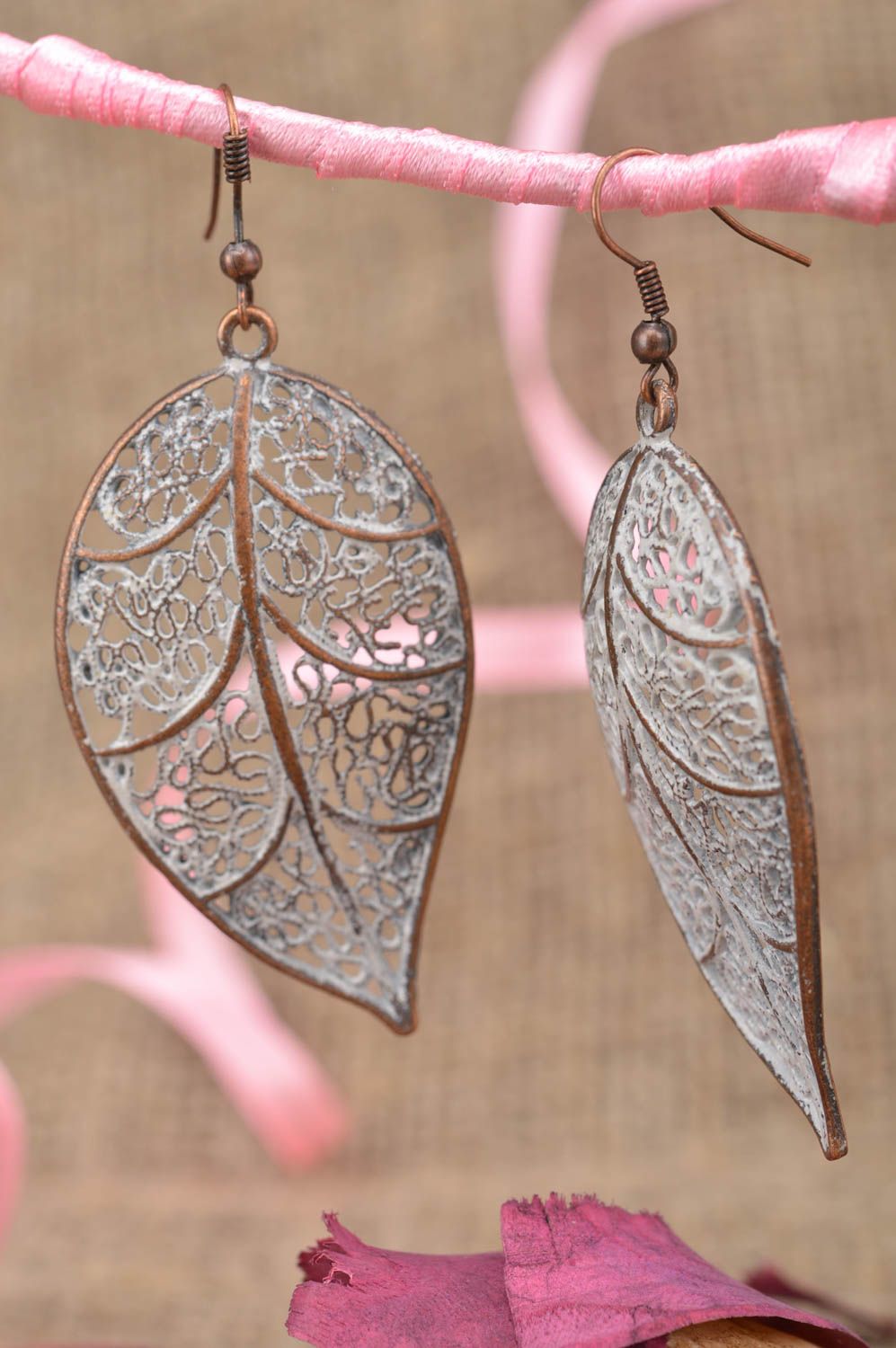 Metal elegant beautiful handmade earrings in shape of leaves for present photo 1