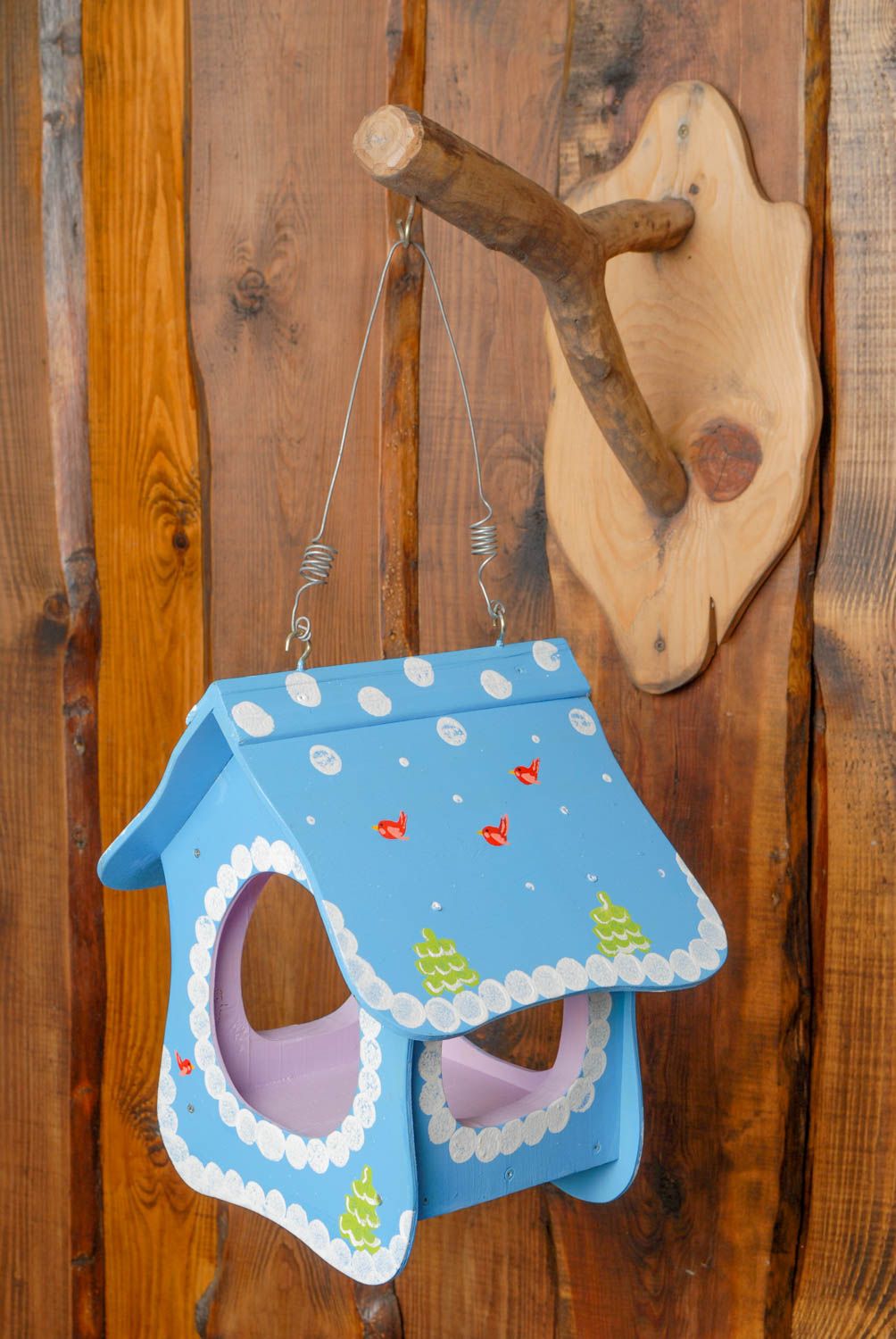 Wooden bird feeder in the shape of house photo 1