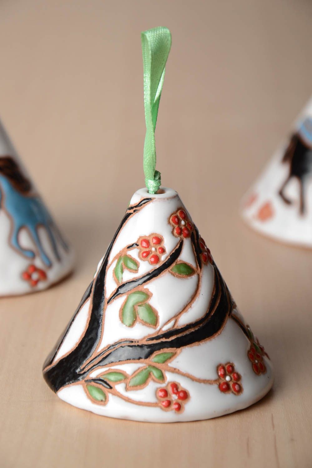 Beautiful handmade painted ceramic bell on the ribbon photo 1