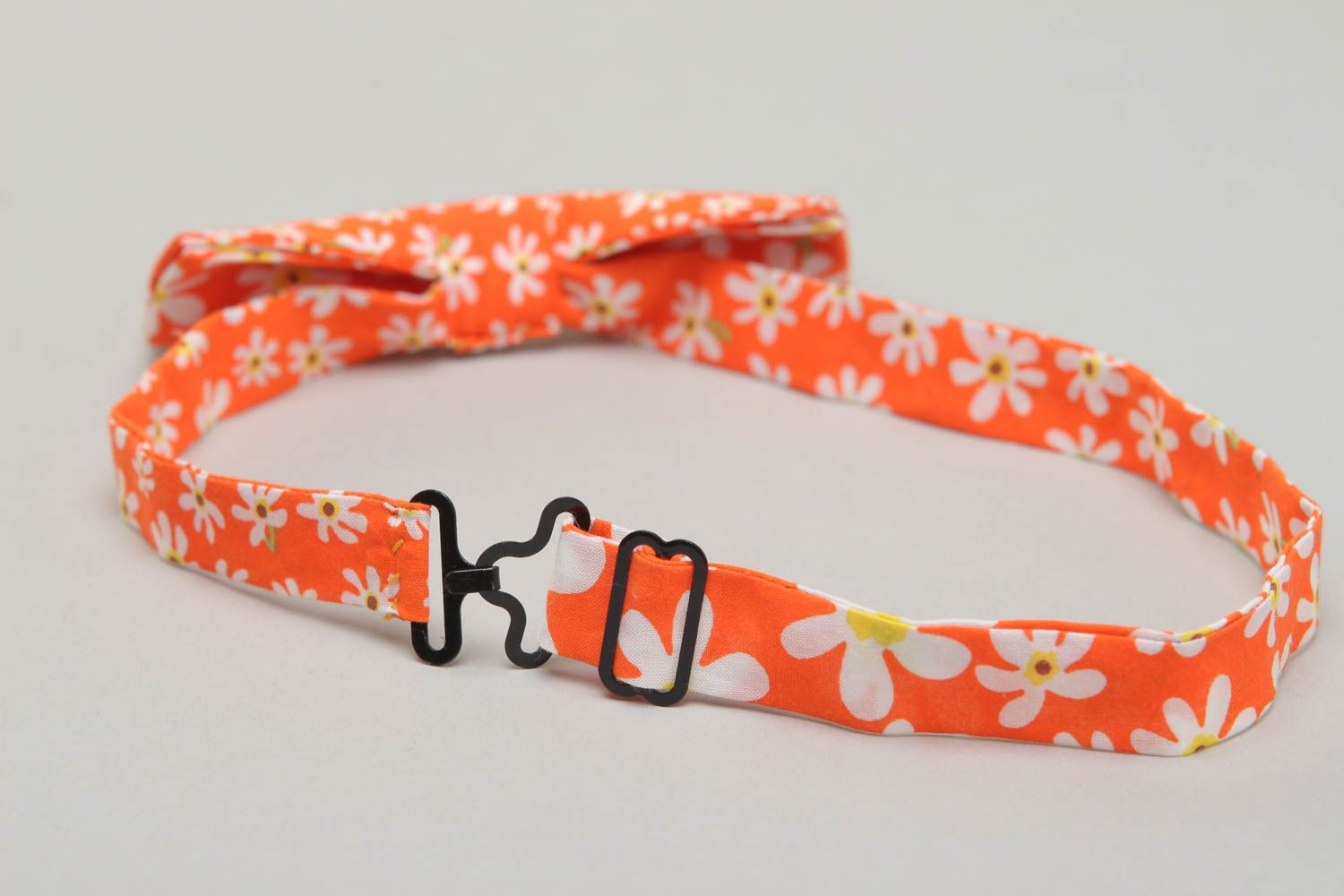 Orange fabric bow tie with floral pattern photo 3