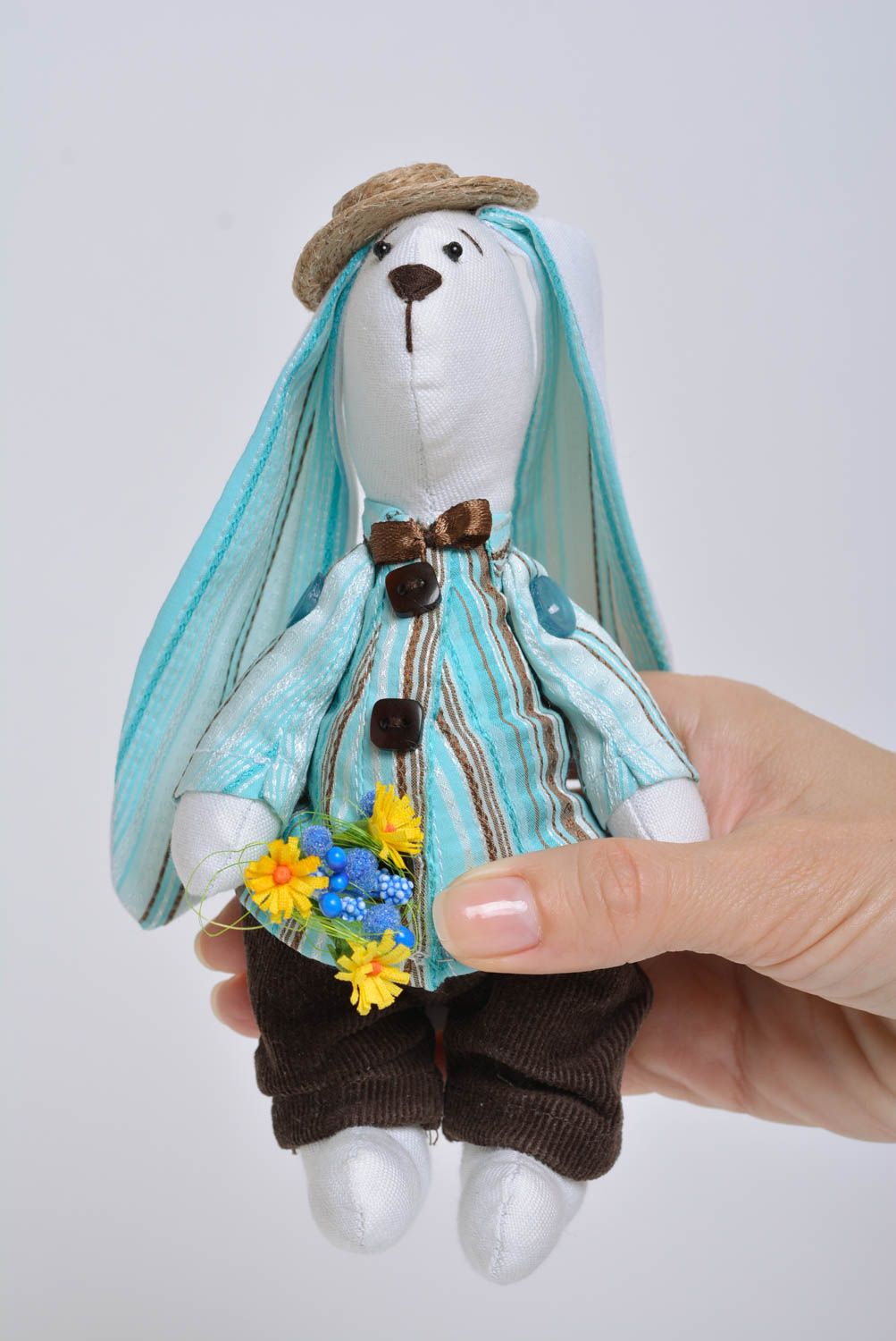 Handmade designer soft toy sewn of cotton rabbit in blue costume with bouquet photo 5