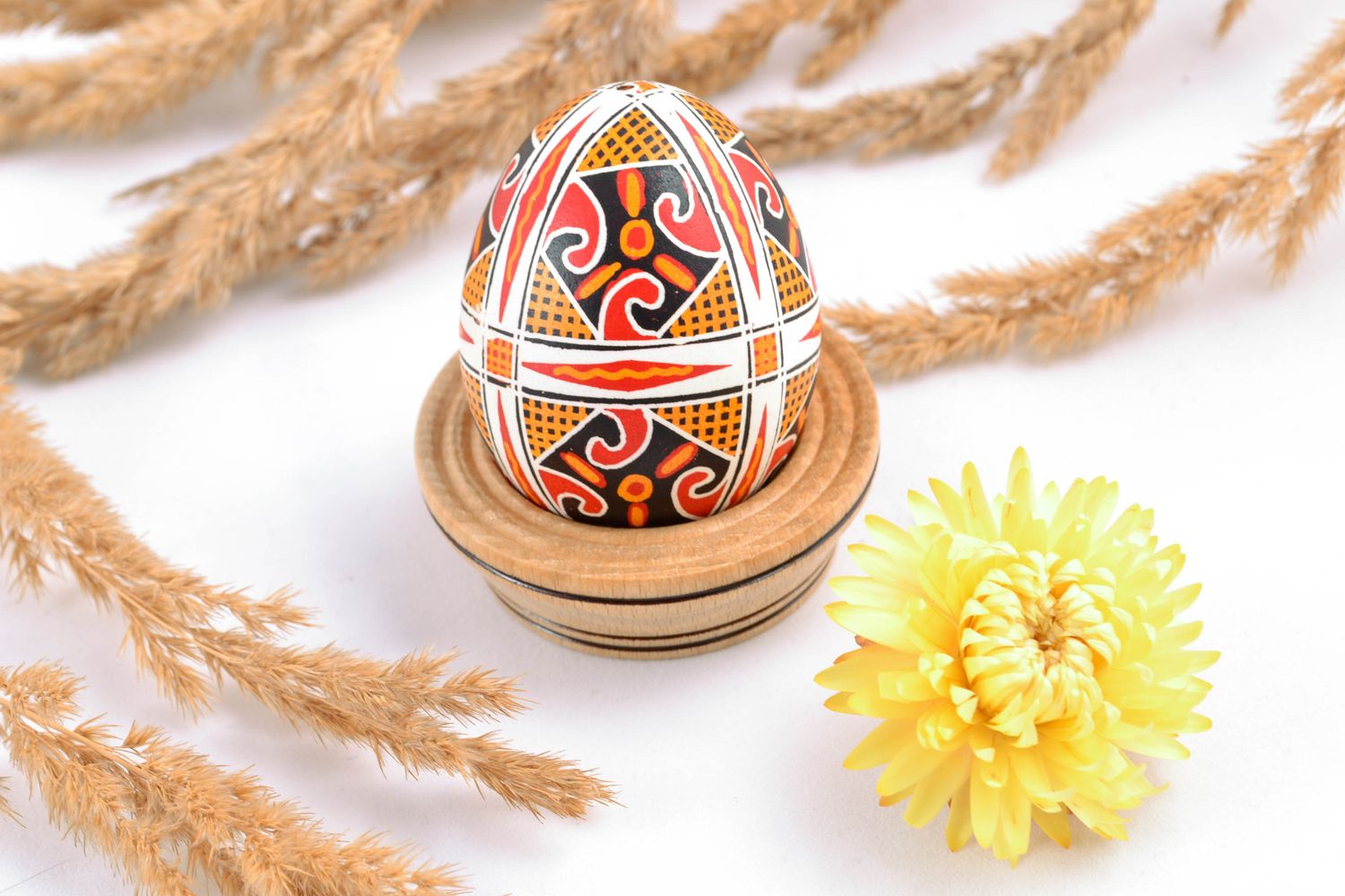 Handmade Easter egg painted with solar symbols photo 1