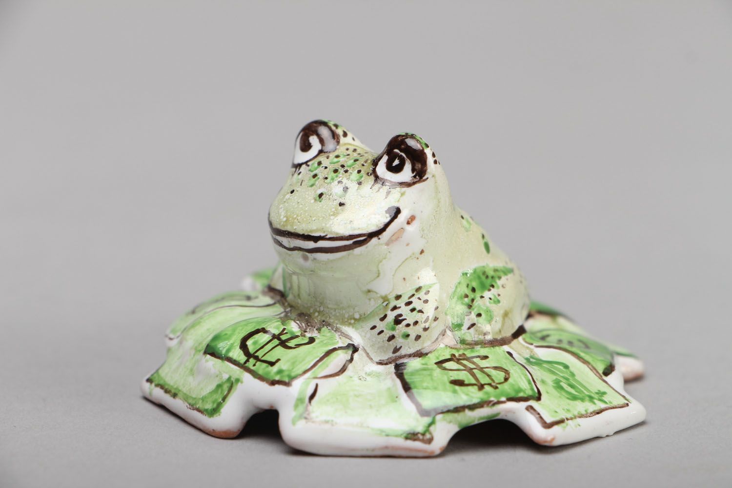 Figurilla cerámica con forma de rana que atrae el dinero foto 1