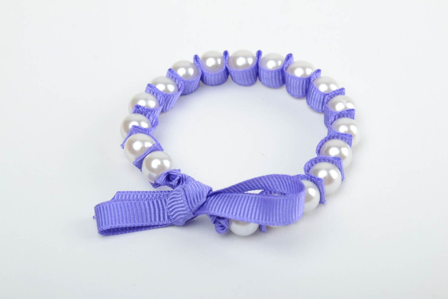 Handmade thin wrist bracelet with plastic pearl like beads and violet rep ribbon photo 2