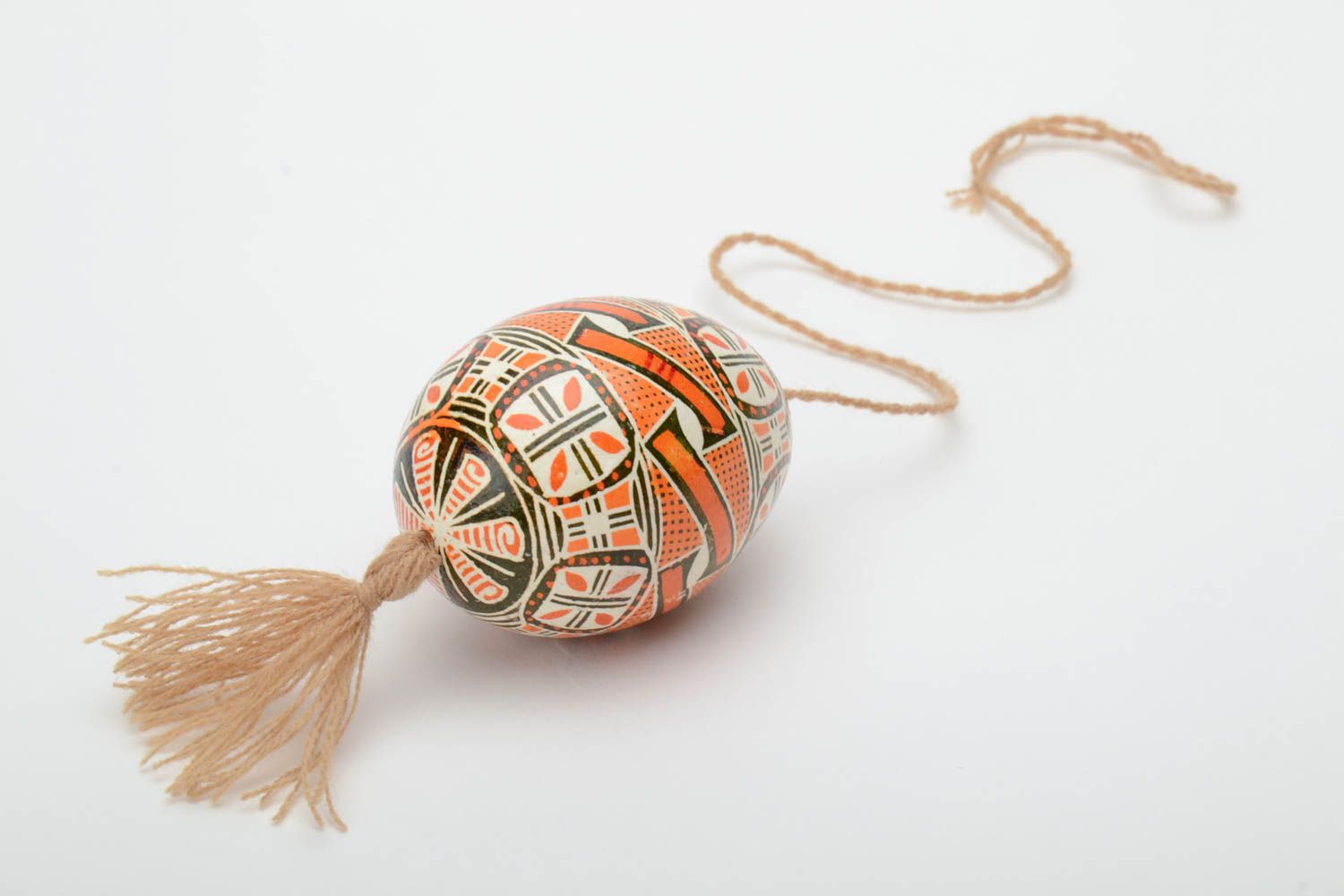 Handmade decorative Easter egg painted in brown color palette with beige tassel photo 4
