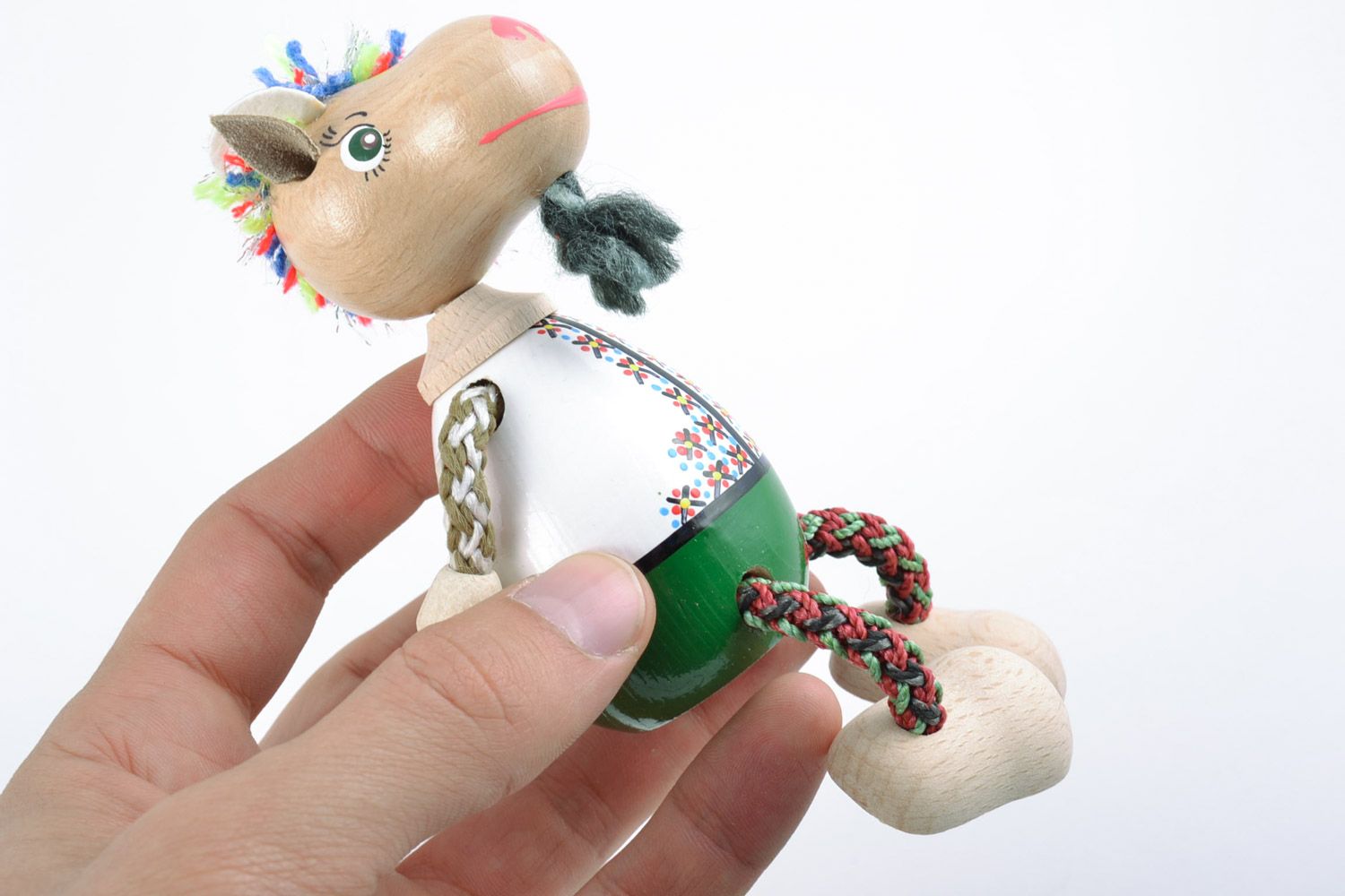 Handmade painted wooden eco toy in the shape of small goat in costume and hat photo 2
