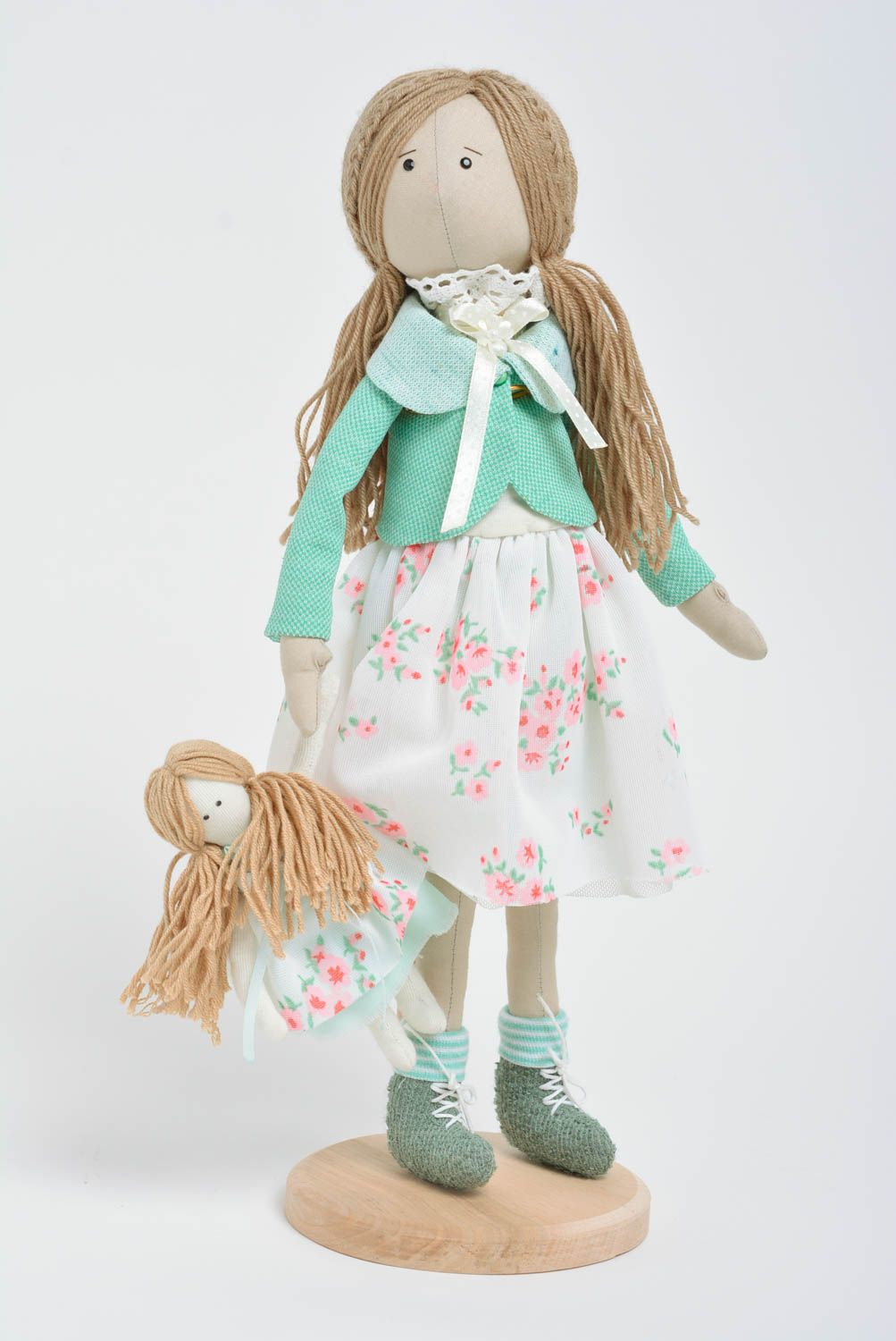 Handmade designer fabric soft doll girl in mint jacket with little soft toy photo 1