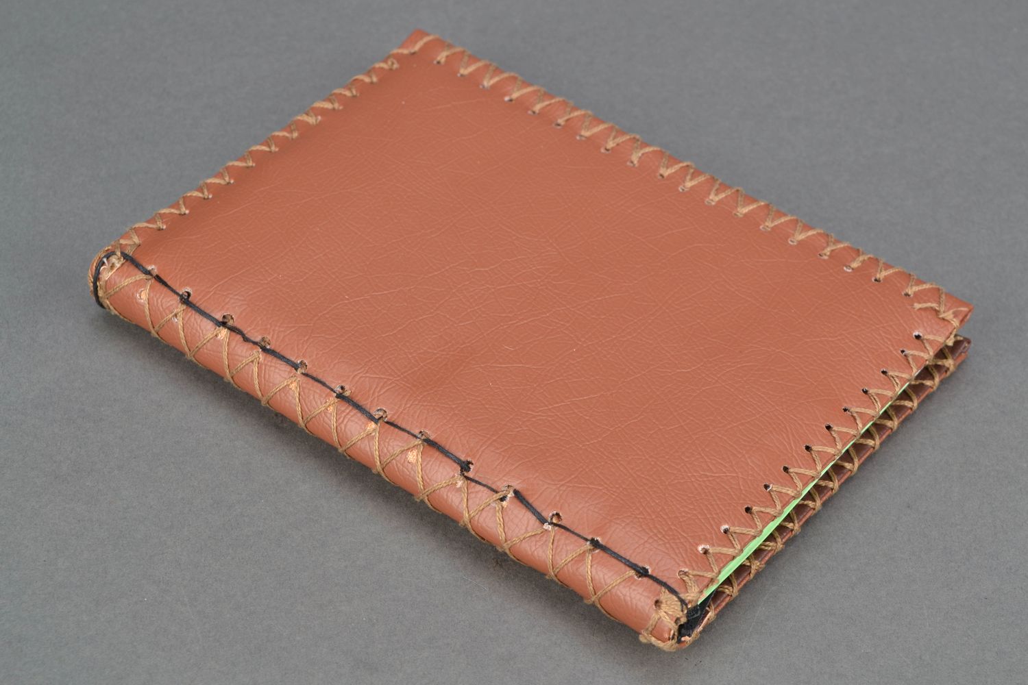 Hand bound notebook with artificial leather cover photo 1