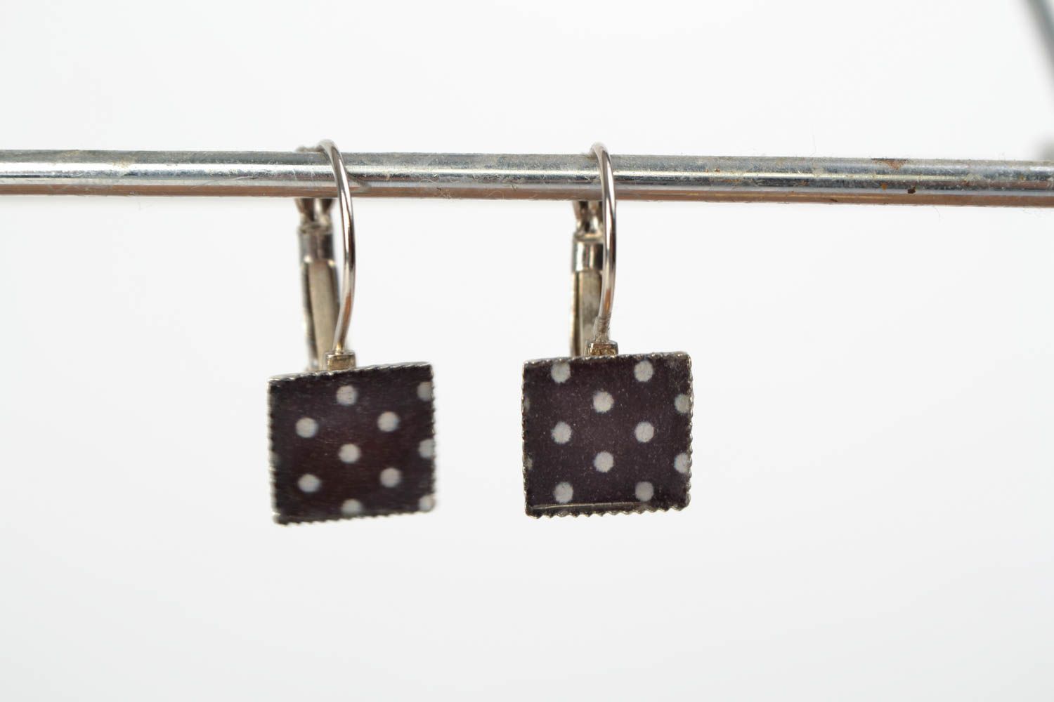 Handmade stylish earrings with jewelry resin of square shape with decoupage black with white photo 2