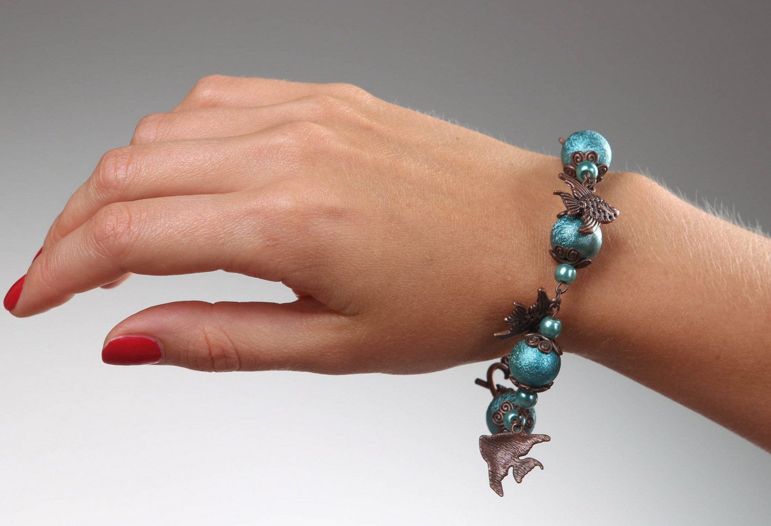 Ceramic pearls bracelet with fishes photo 4