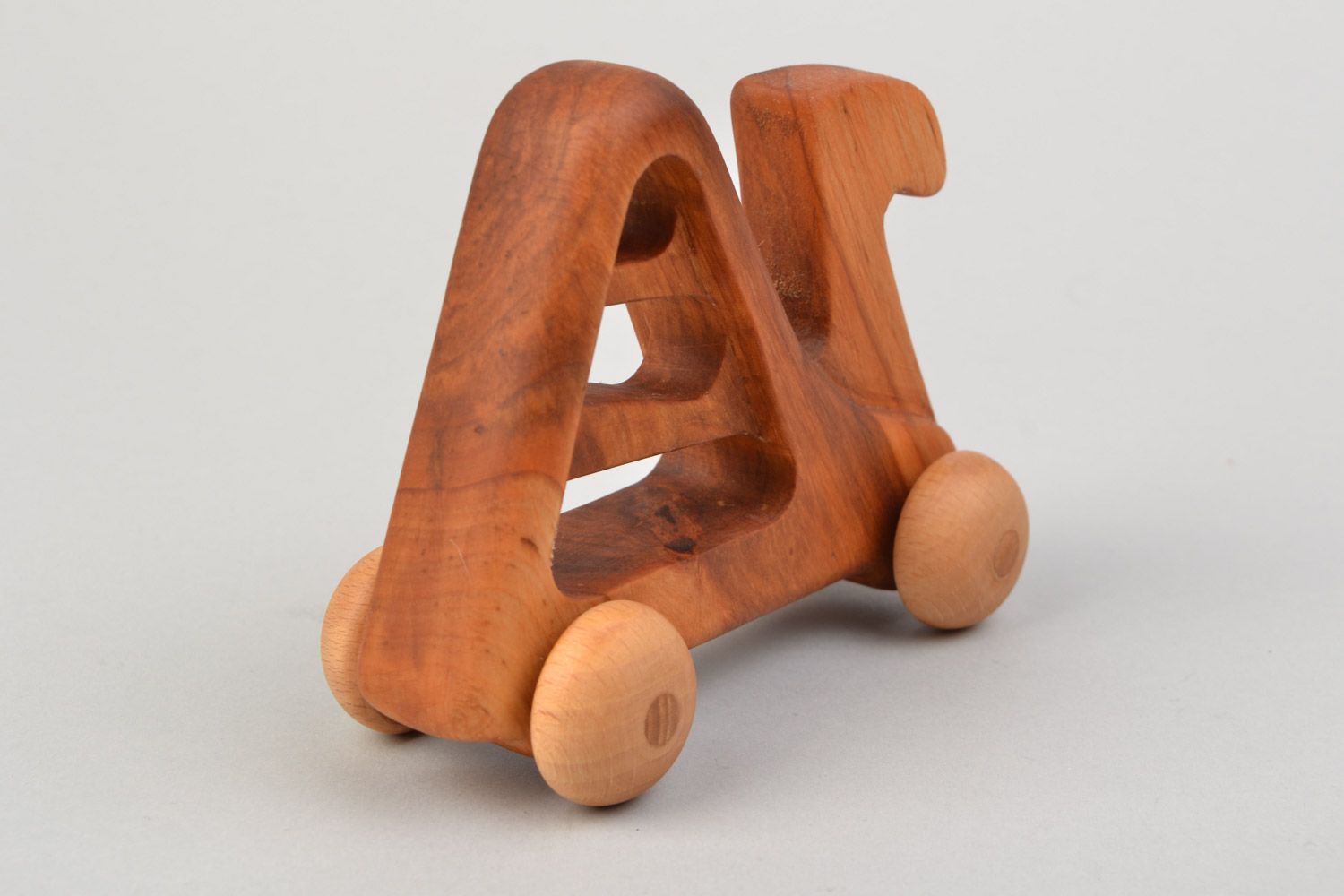 Handmade wooden wheeled toy camel imbued with linseed oil  photo 5