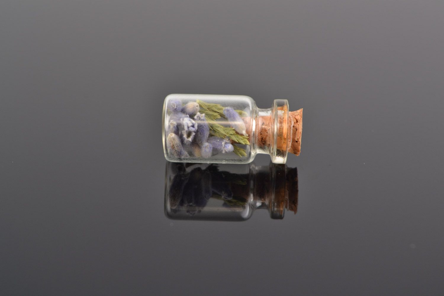 Handmade neck pendant in the shape of glass flask with lavender and juniper inside photo 1