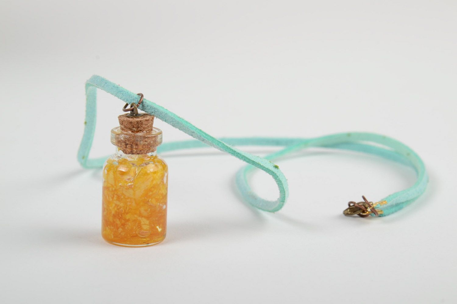Handmade neck pendant with yellow flowers coated with epoxy resin in the shape of vial photo 4