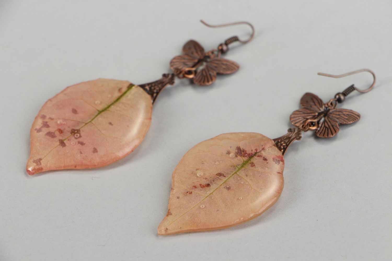 Long earrings made ​​of copper and epoxy resin with natural leaf photo 1
