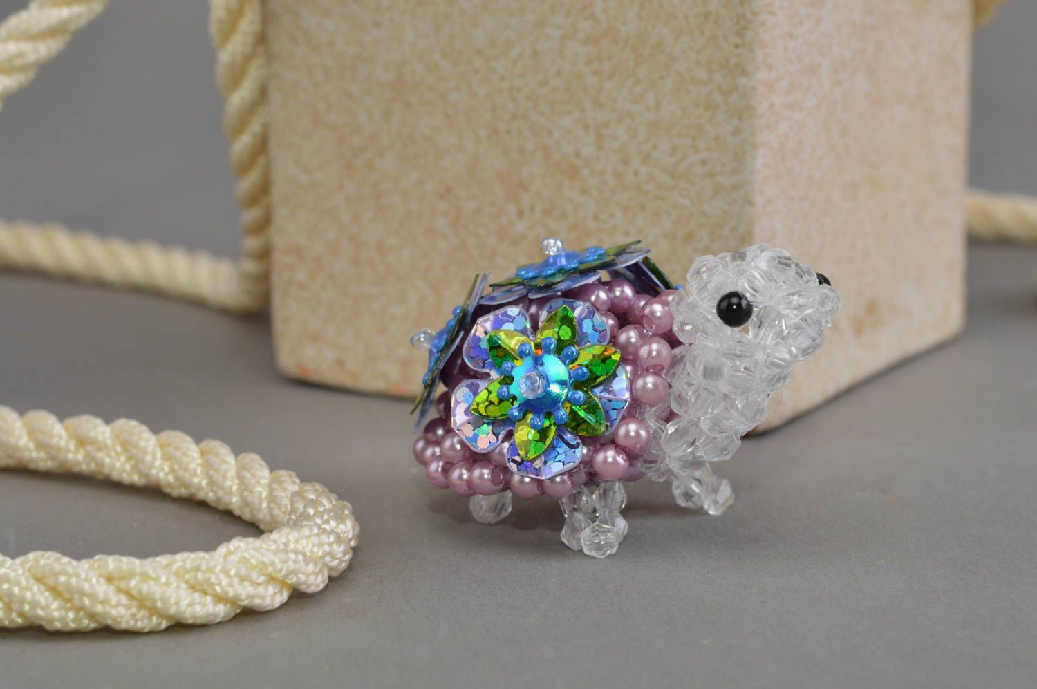 Handmade small decorative bead woven statuette of turtle with flowers for home photo 1