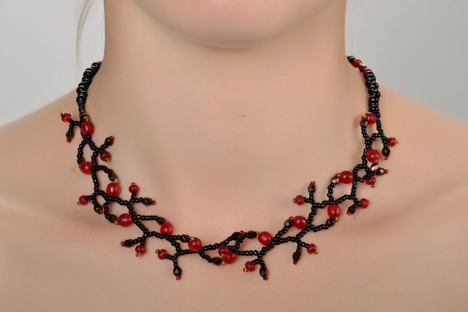 Black and red necklace made of beads photo 1