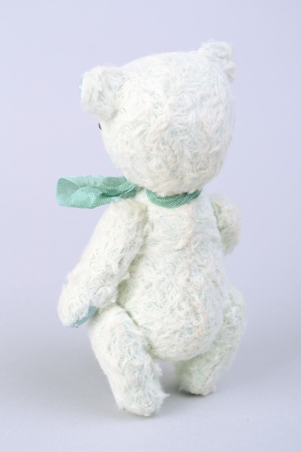 Handmade designer soft toy bear in light color palette with bow and key charm photo 5