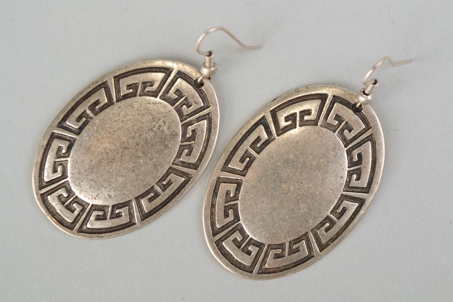 Unusual round metal earrings in ethnic style photo 3