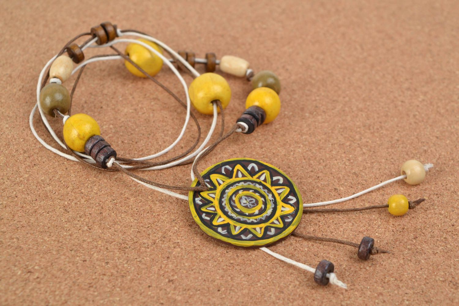 Handmade ethnic yellow and black polymer clay neck pendant on a cord with beads  photo 1