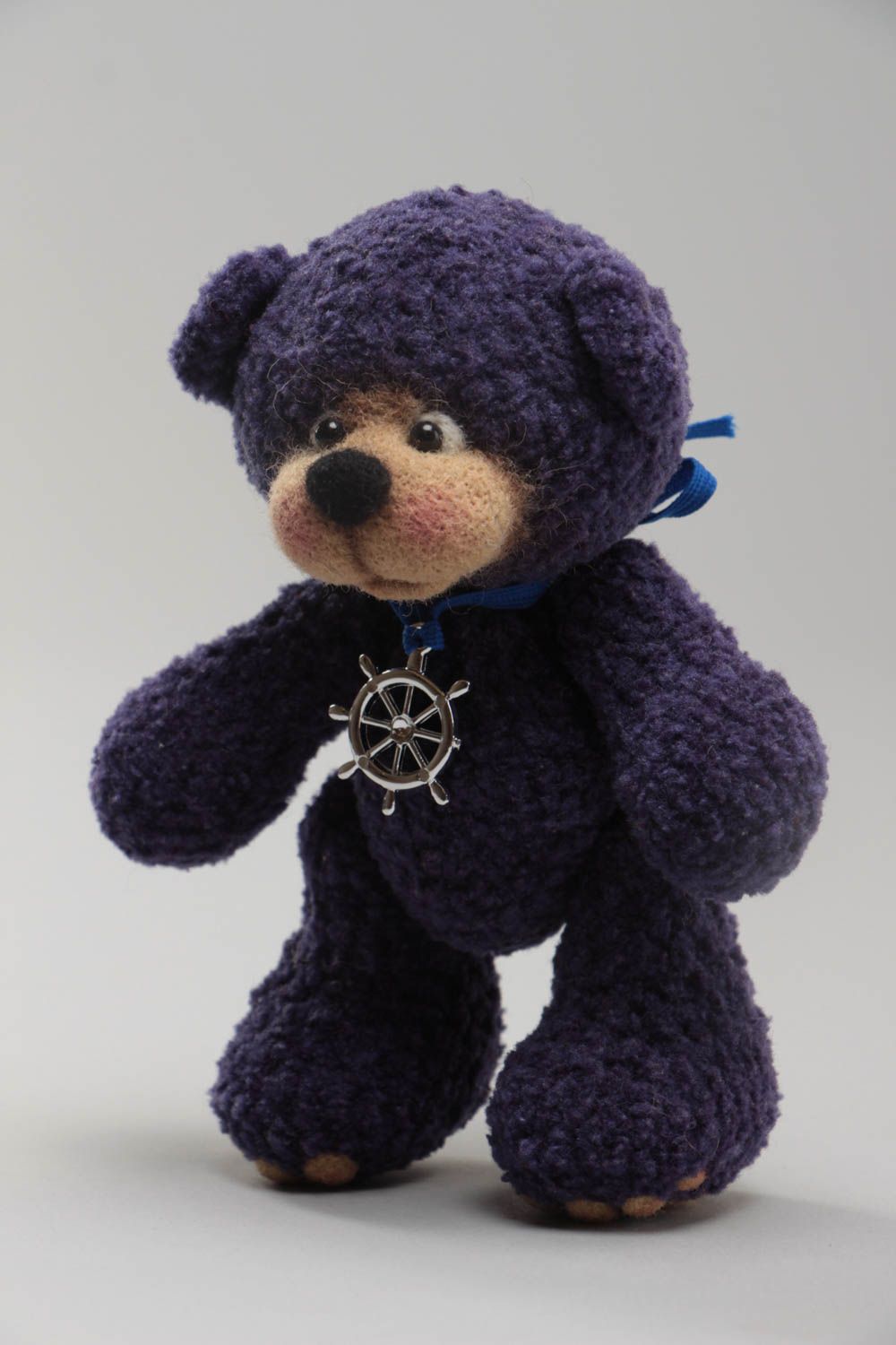 Handmade designer soft toy crocheted of woolen threads blue bear with charm photo 2
