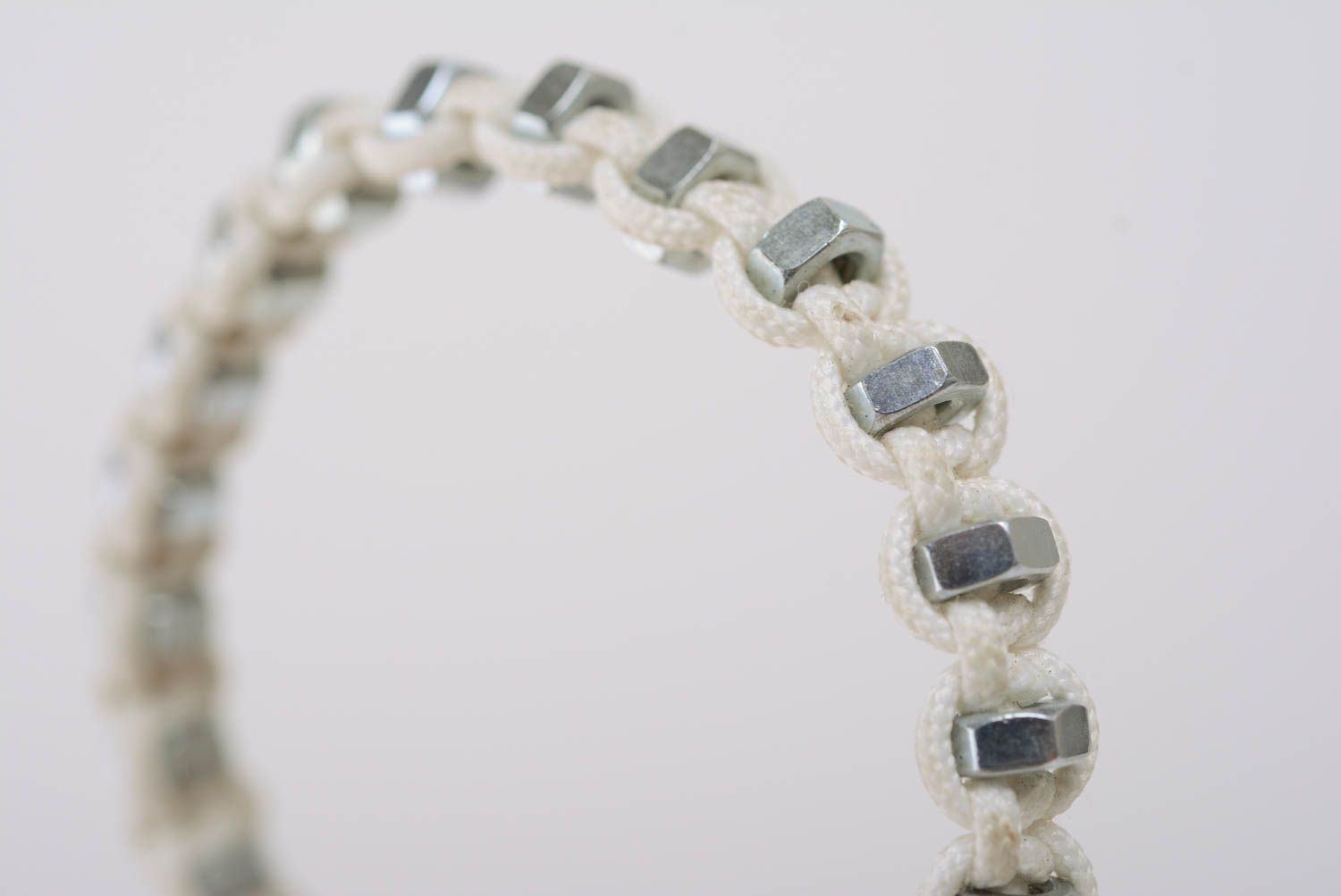 White women's handmade designer macrame woven cord bracelet with steel nuts photo 4