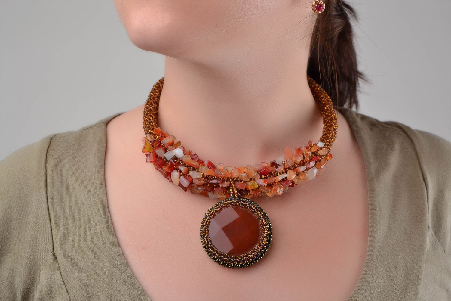 Handmade designer beaded necklace made of natural stones of amber color photo 1