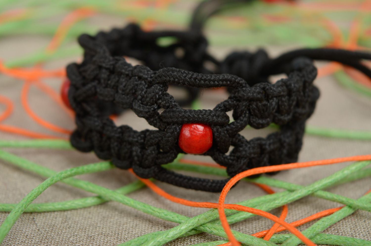 Macrame polyester cord bracelet with painted wooden beads photo 2