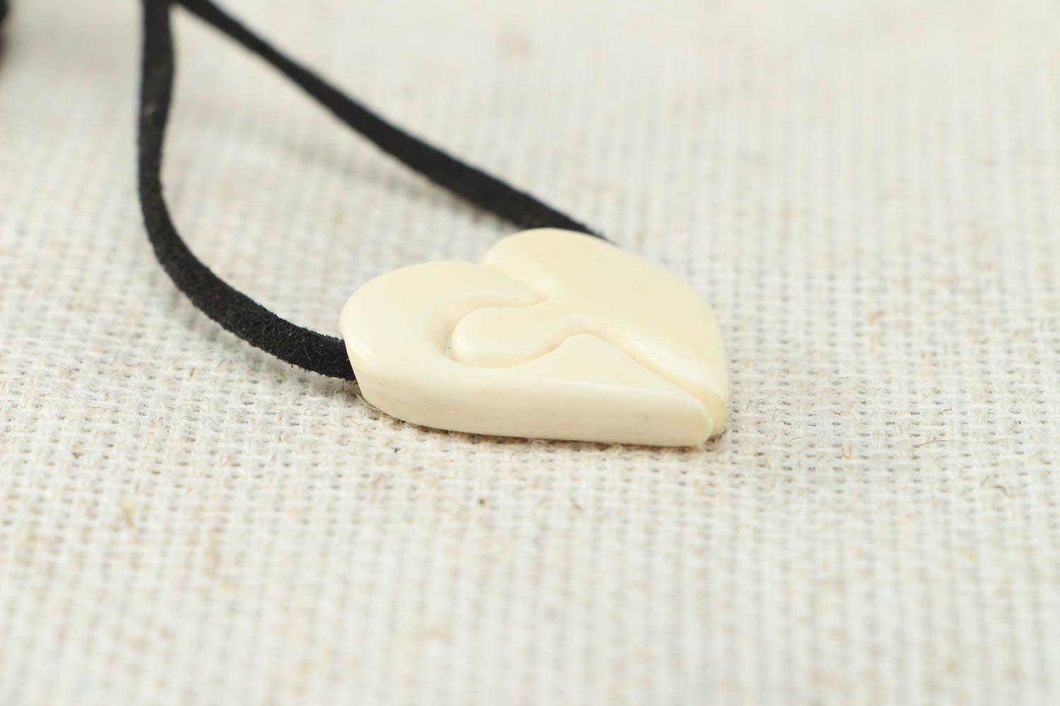 Heart shaped pendant carved of cow bone photo 2